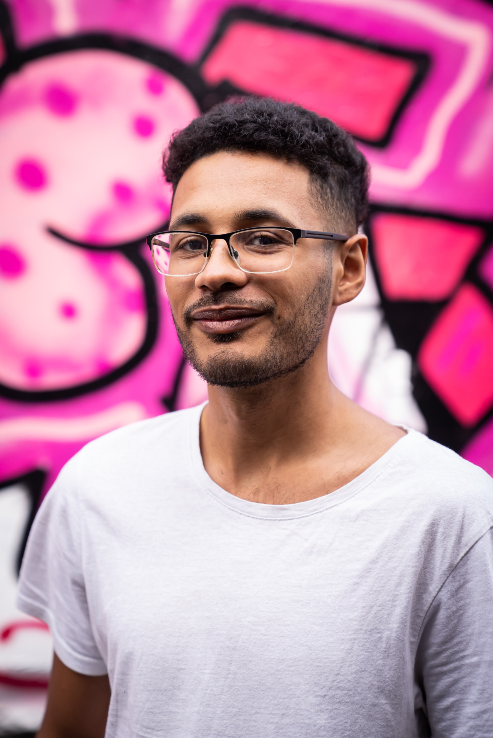 Jake Michael Christian in front of street art. Beeston Media video production bristol science and technology video production higher education video production.