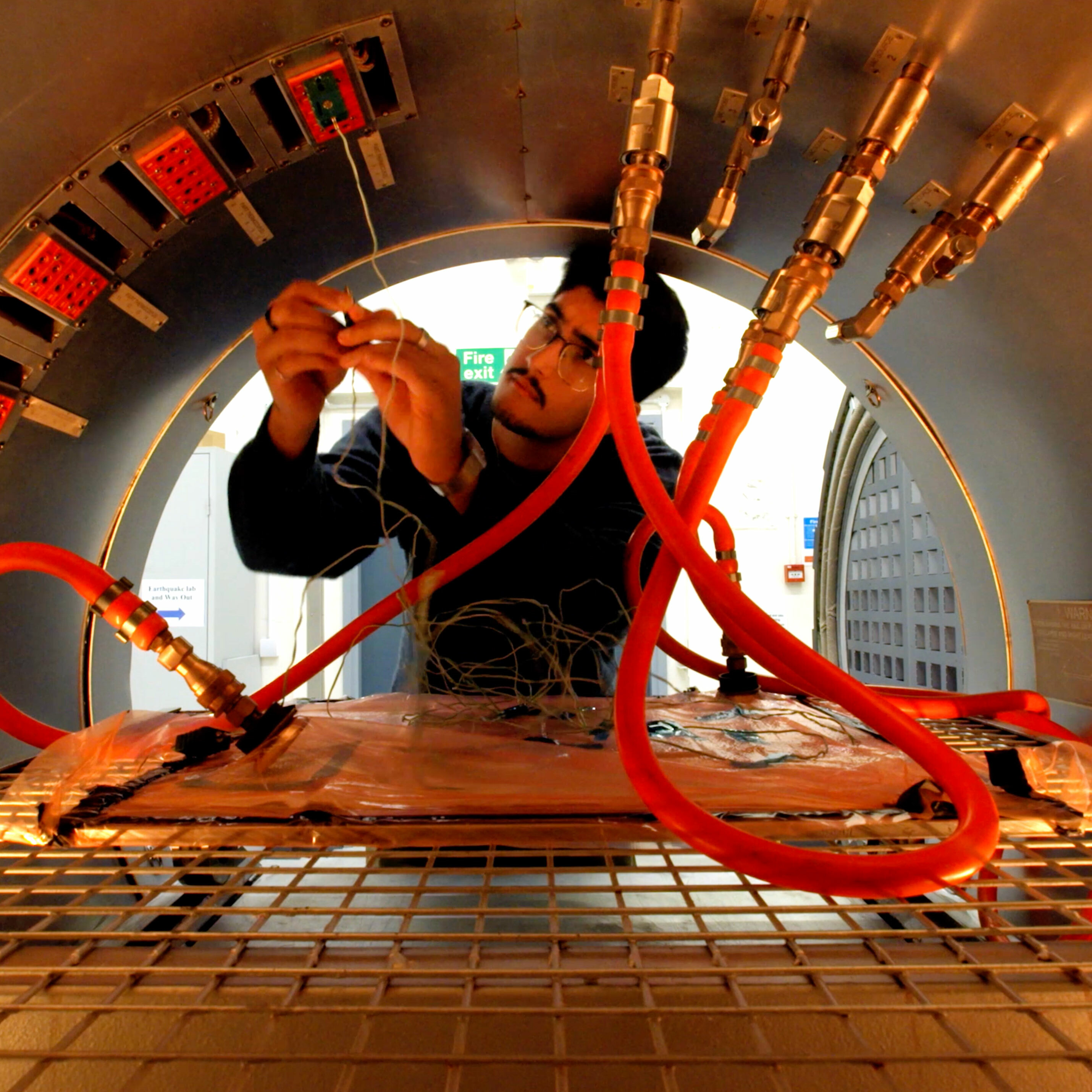 Shot of student from inside autoclave in University of Bristol Faculty of Engineering. Beeston Media video production bristol science and technology video production higher education video production.