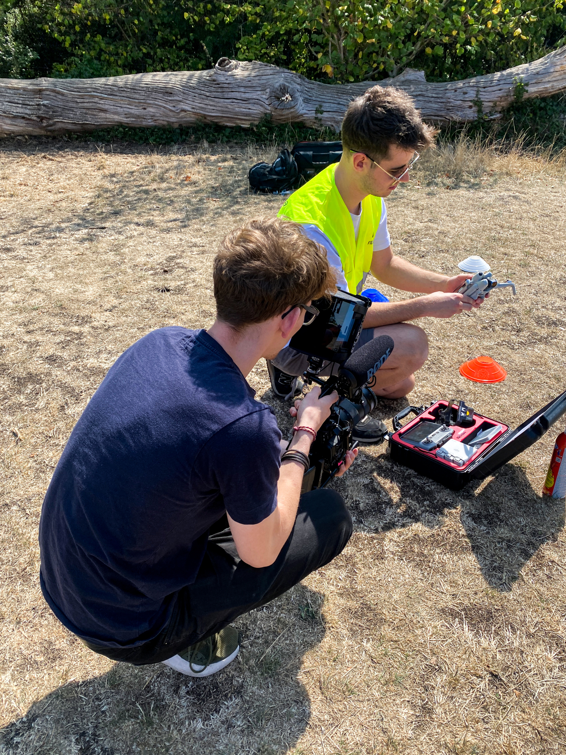 A behind the scenes photo of Nick capturing Joe setting up the drone. Beeston Media video production Bristol, science and technology video production, higher education video production.