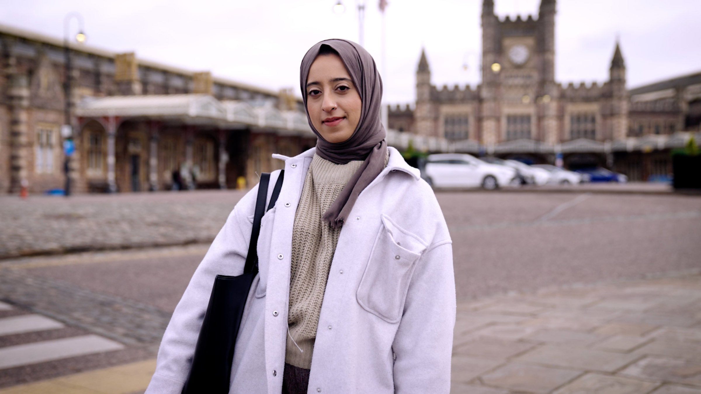 Close-up of Alumni Scholarship student Misbah in taxi. Beeston Media video production bristol science and technology video production higher education video production.