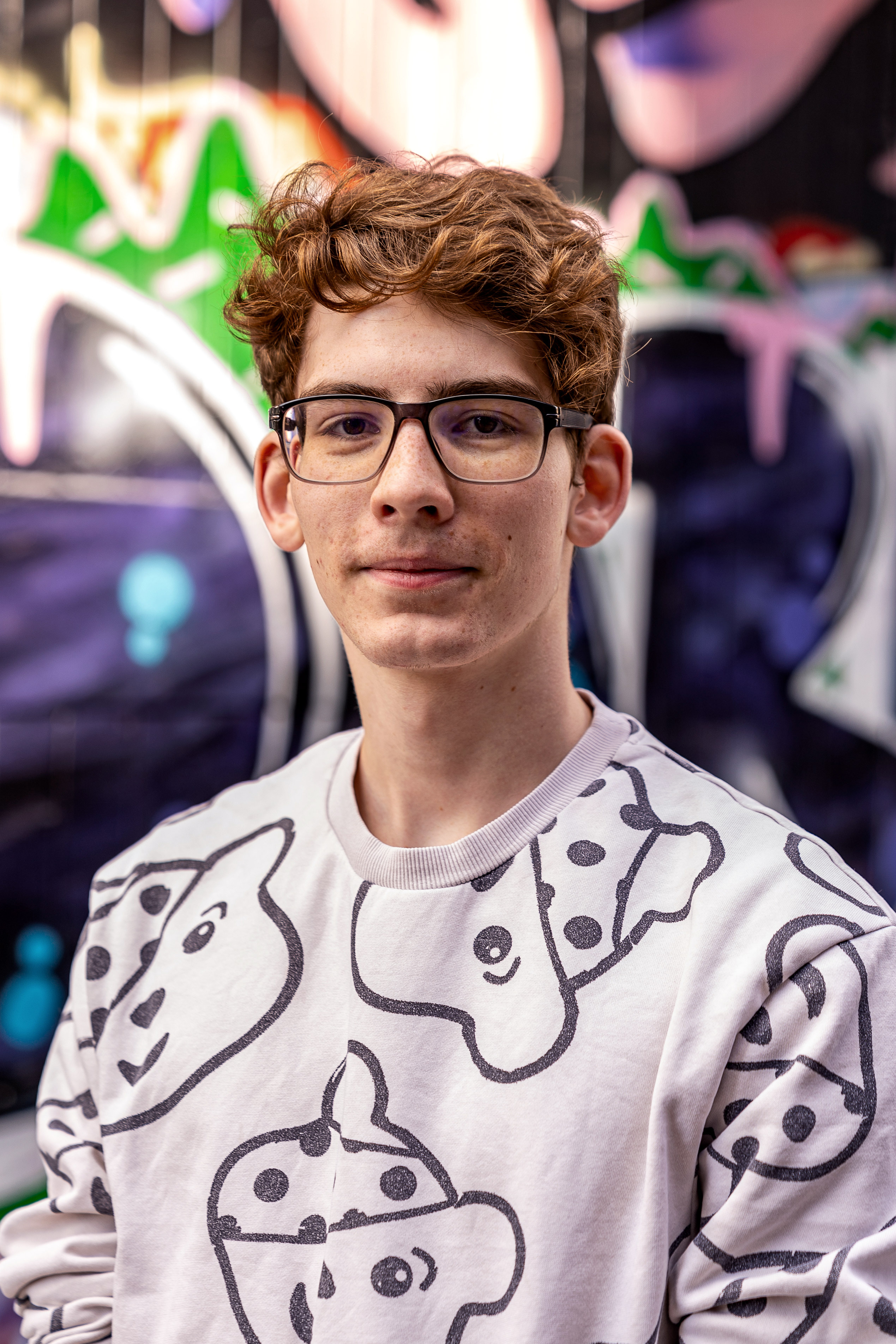 Nick O'Leary in front of street art. Beeston Media video production bristol science and technology video production higher education video production.