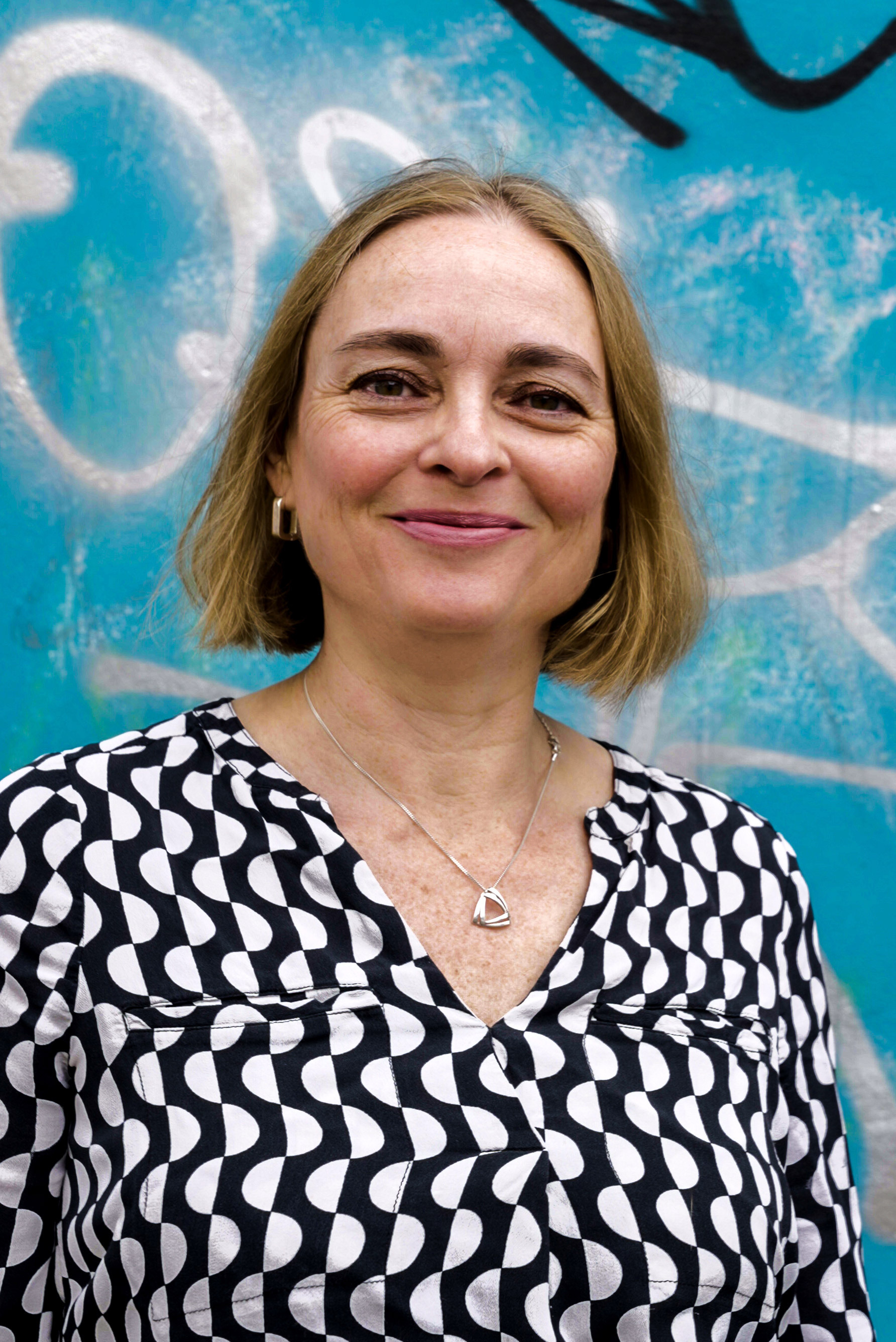 Penny Beeston in front of street art. Beeston Media video production bristol science and technology video production higher education video production