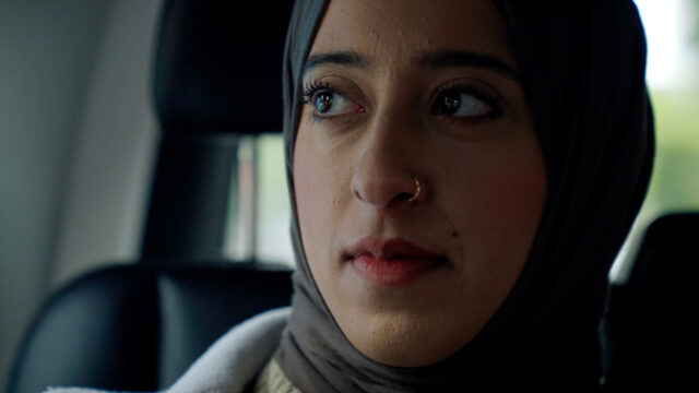 Close-up of Alumni Scholarship student Misbah in taxi. Beeston Media video production bristol science and technology video production higher education video production.